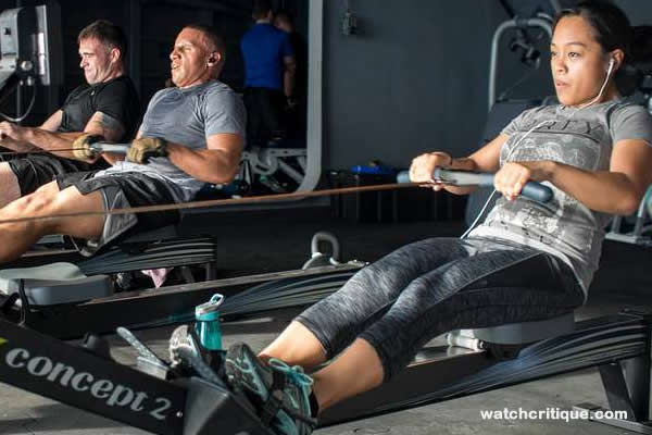 Sailors exercise on a rowing machine
